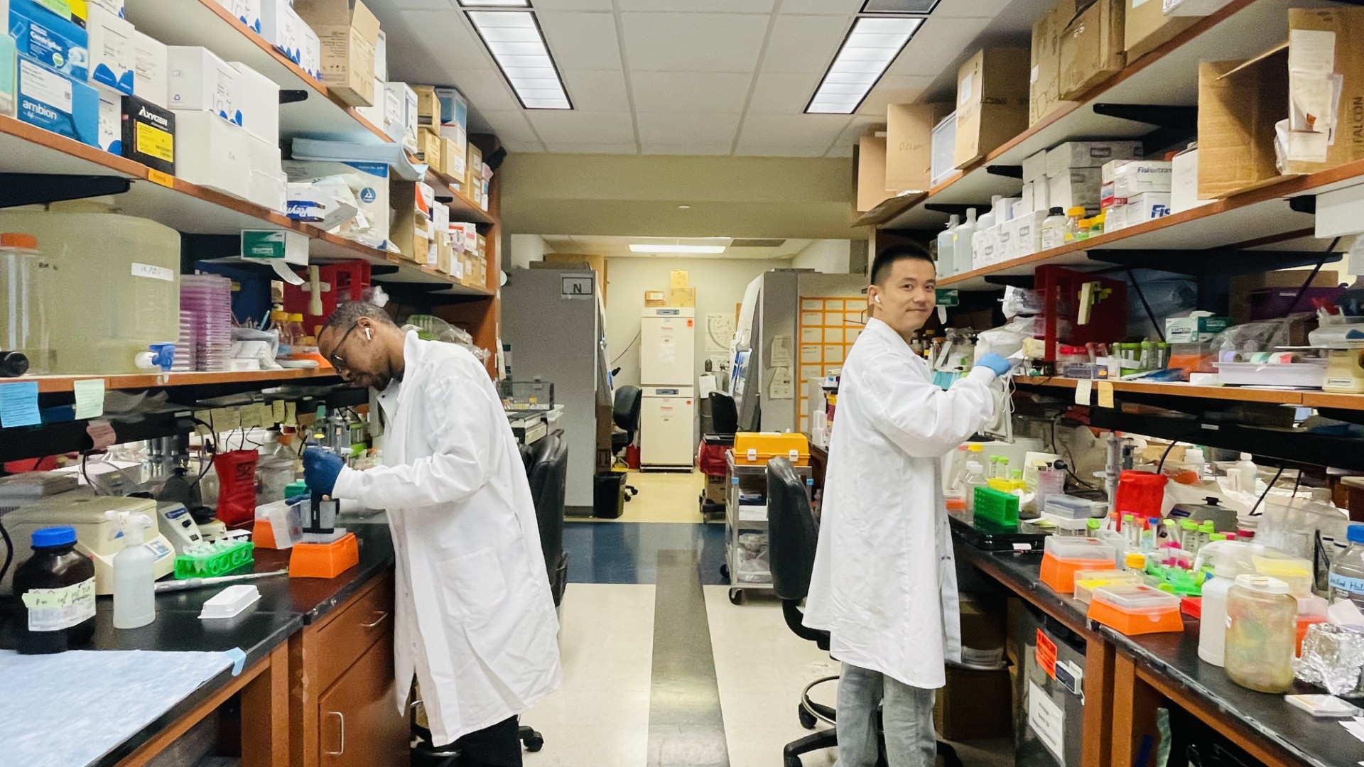 Photo of Kory Wells and Songyu Wu working in the lab