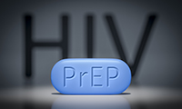 Pill with "PrEP" on it. The word HIV in the background.
