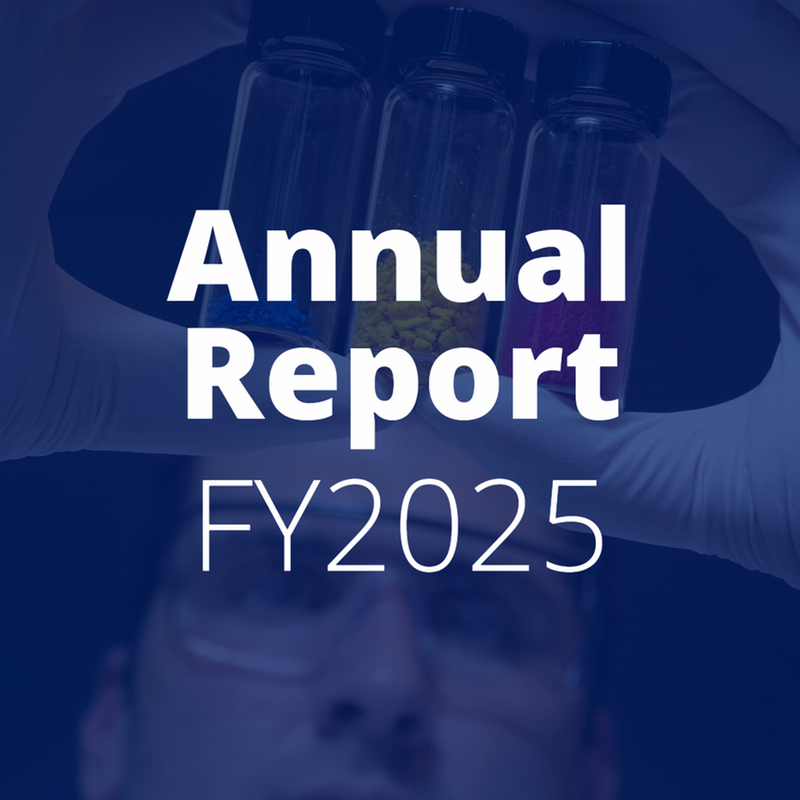 Image of a researcher holding vials of blue, yellow, and pink powders. A blue overlay covers the image with text "Annual Report FY2025."