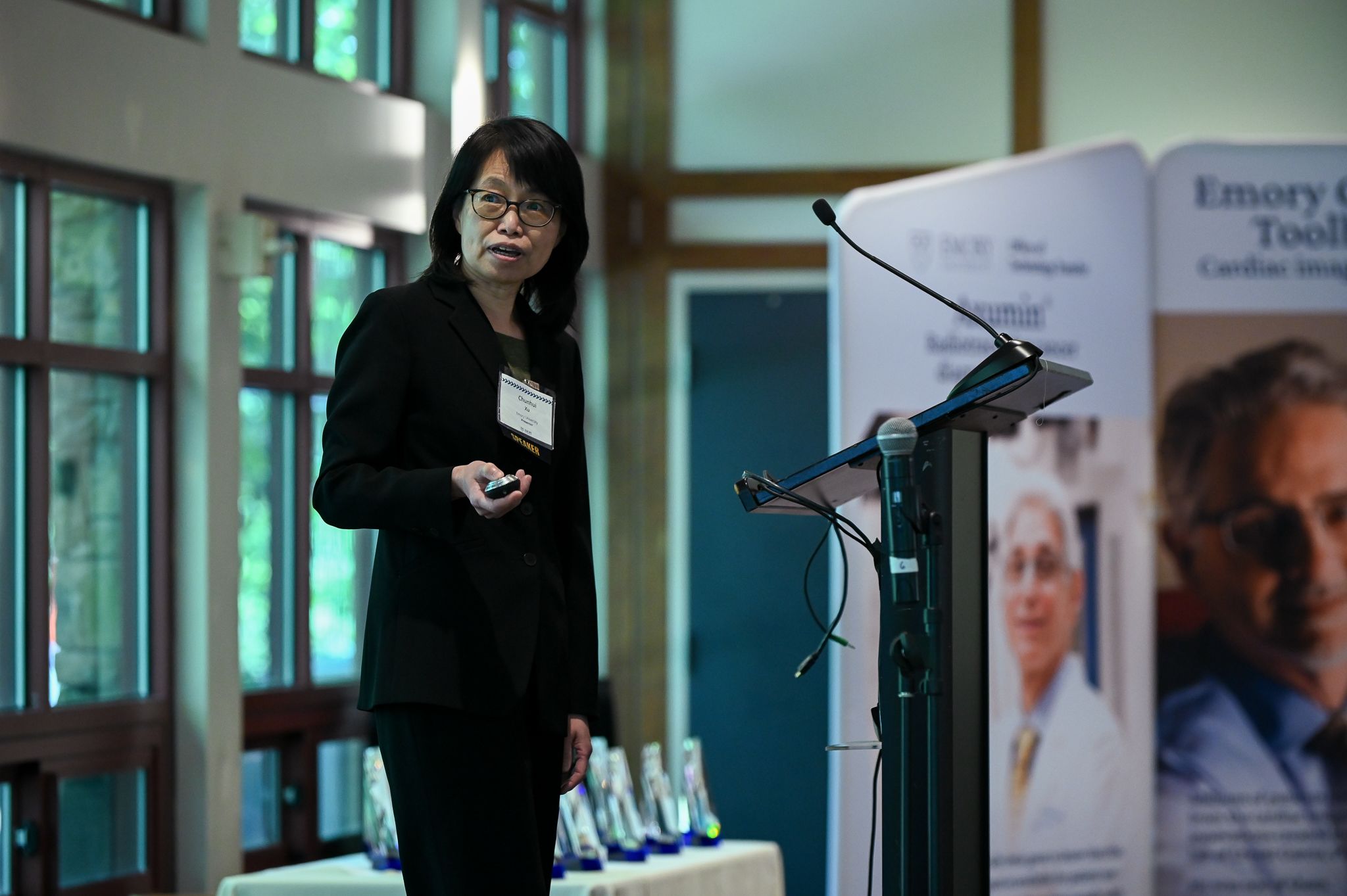 Photo of Chunhui Xu presenting at a podium