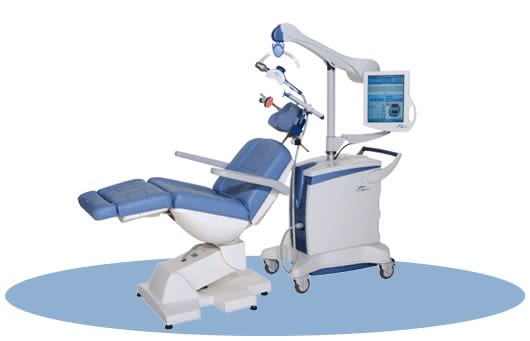 Blue dental chair with attached overhead arm and monitor, designed for TMS patient treatment.