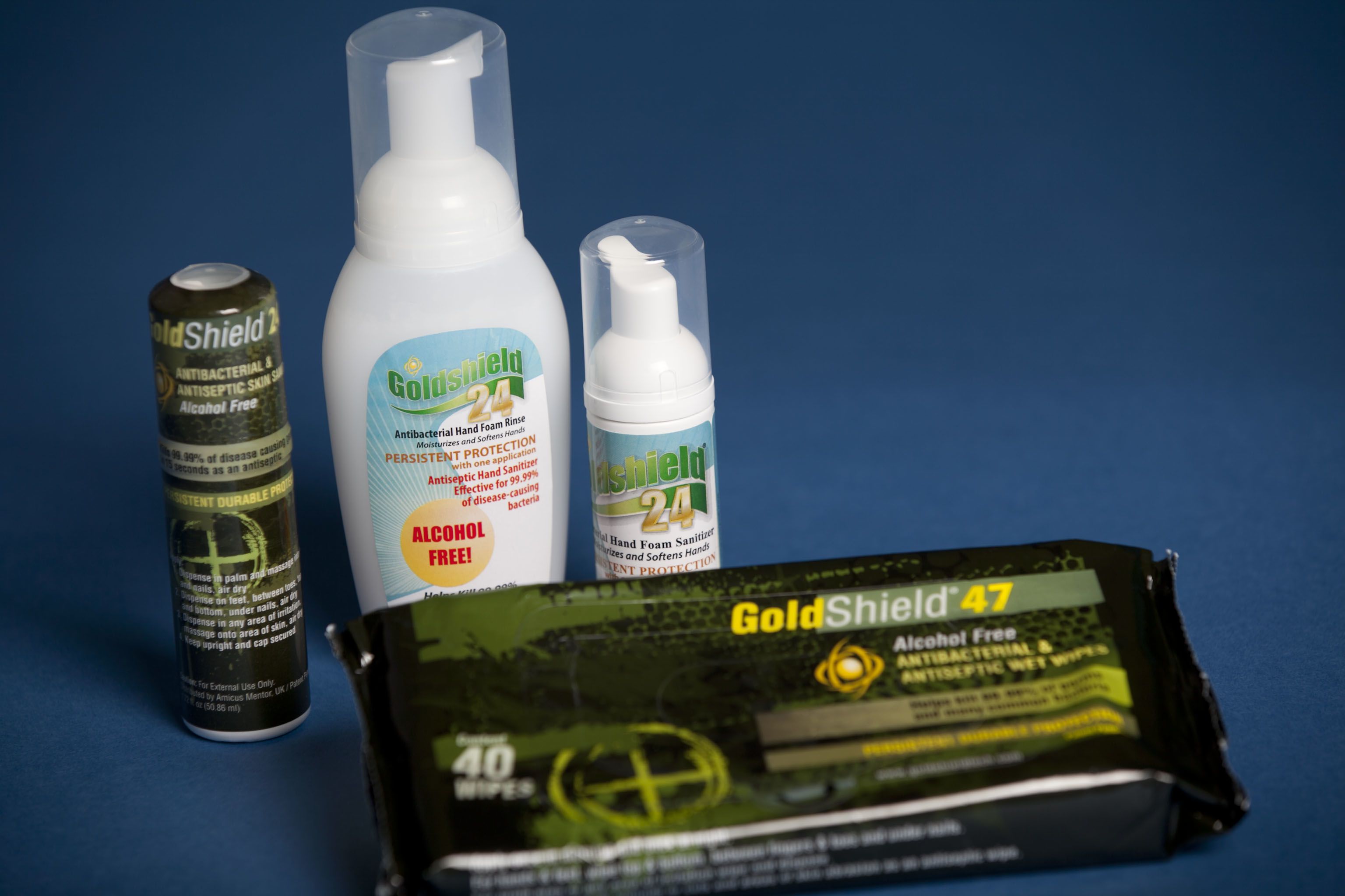 GoldShield antibacterial products including sprays, foam, and wipes, all labeled alcohol-free.