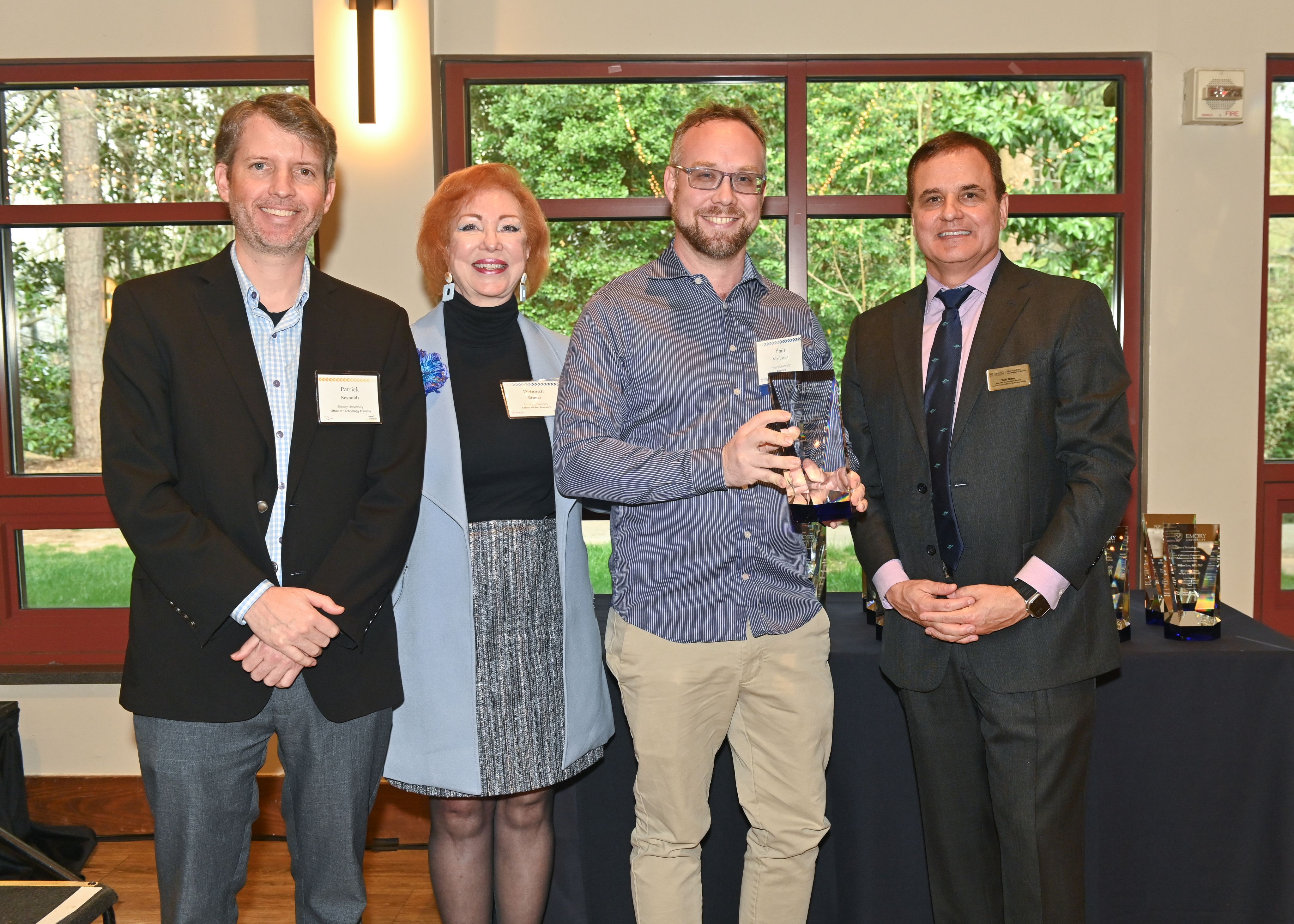Photo of Patrick Reynolds, Deborah Bruner, Ymir Vigfusson, and Todd Sherer